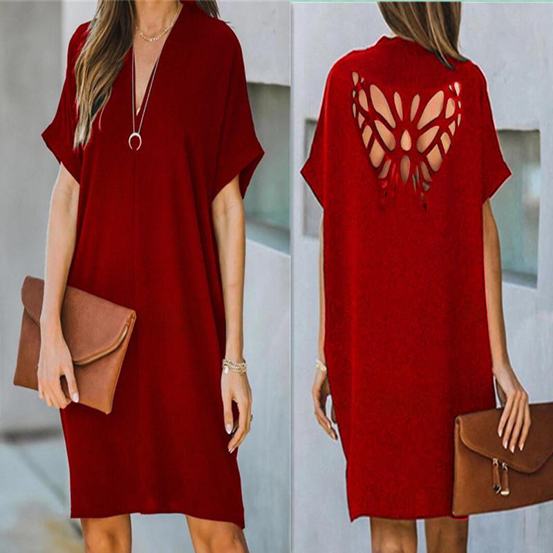 Verano nuevo vestido suelto de color sólido hueco de mariposa