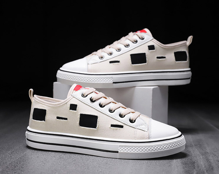 Zapatos de lonas rotas para hombre y mujer