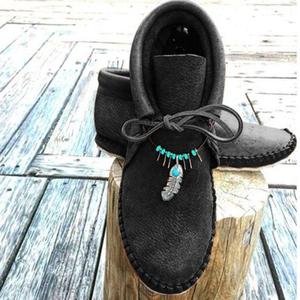 Botas de tacón plano de cuero
