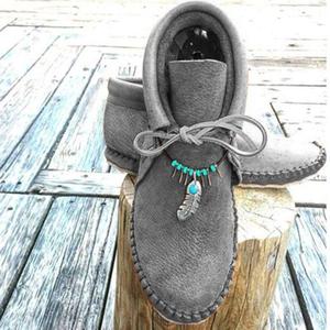 Botas de tacón plano de cuero