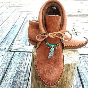 Botas de tacón plano de cuero